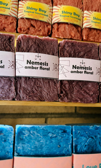 Assorted soap bars with visible branding on a shelf