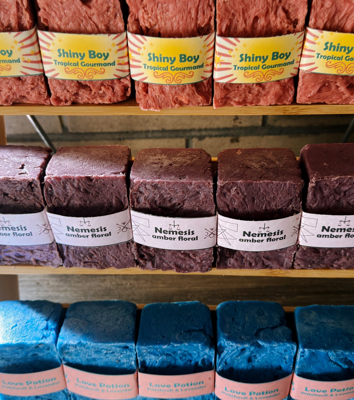 Assorted soaps on shelves with visible branding