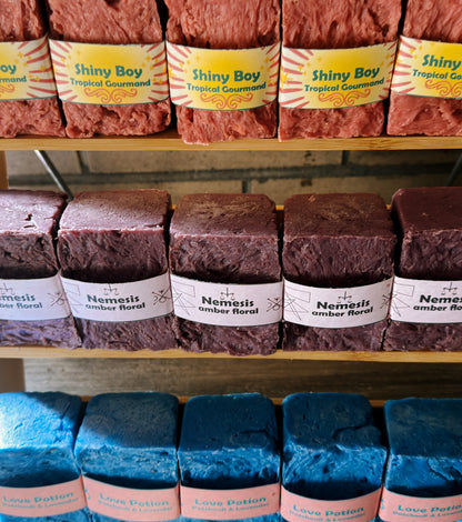 Assorted soaps on shelves with visible branding