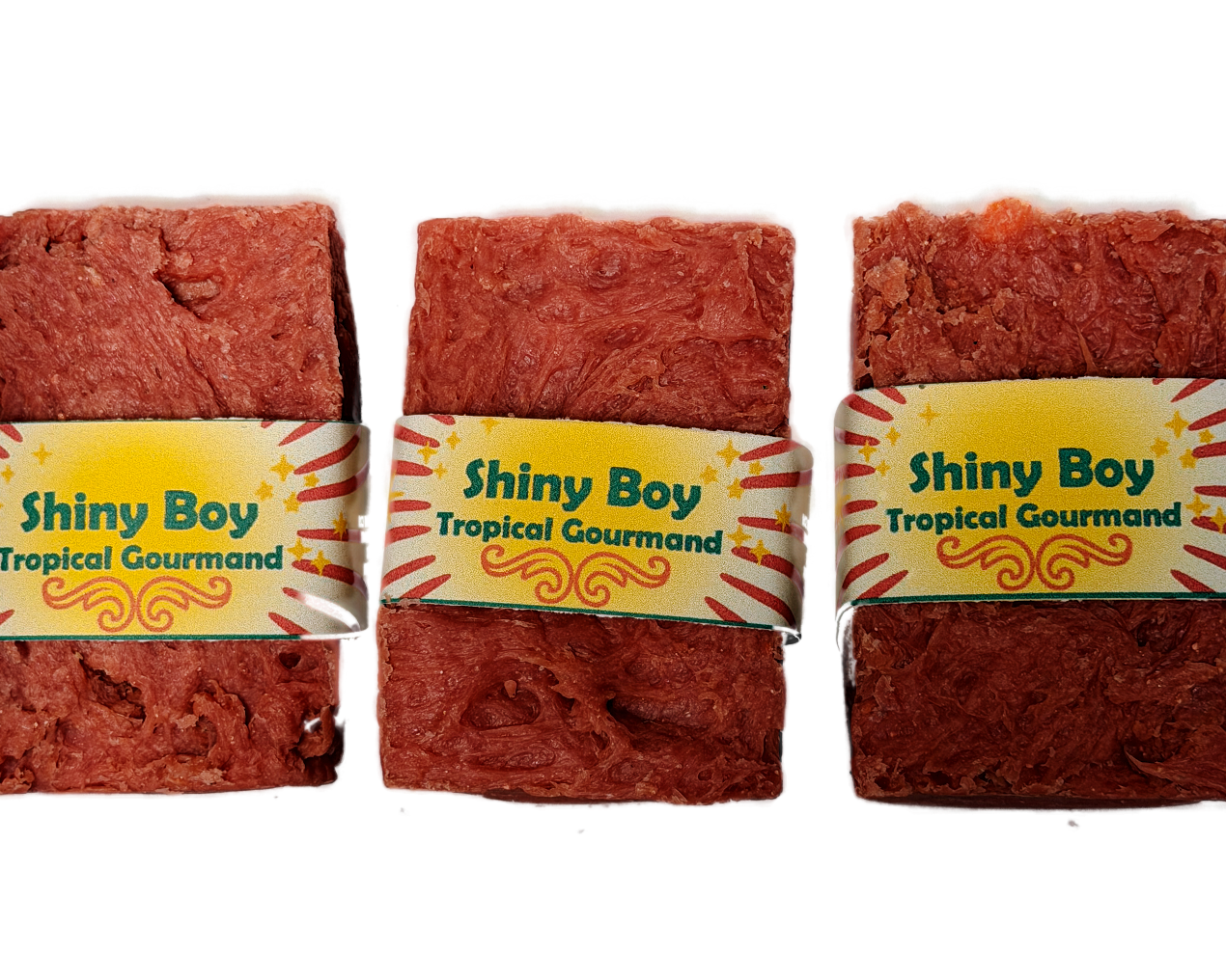 Three Shiny Boy coral soap bars grouped together on a white background, featuring the bold retro yellow sunburst label design