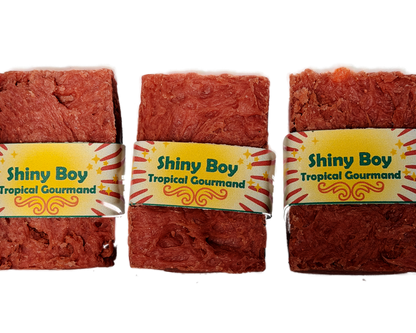 Three Shiny Boy coral soap bars grouped together on a white background, featuring the bold retro yellow sunburst label design