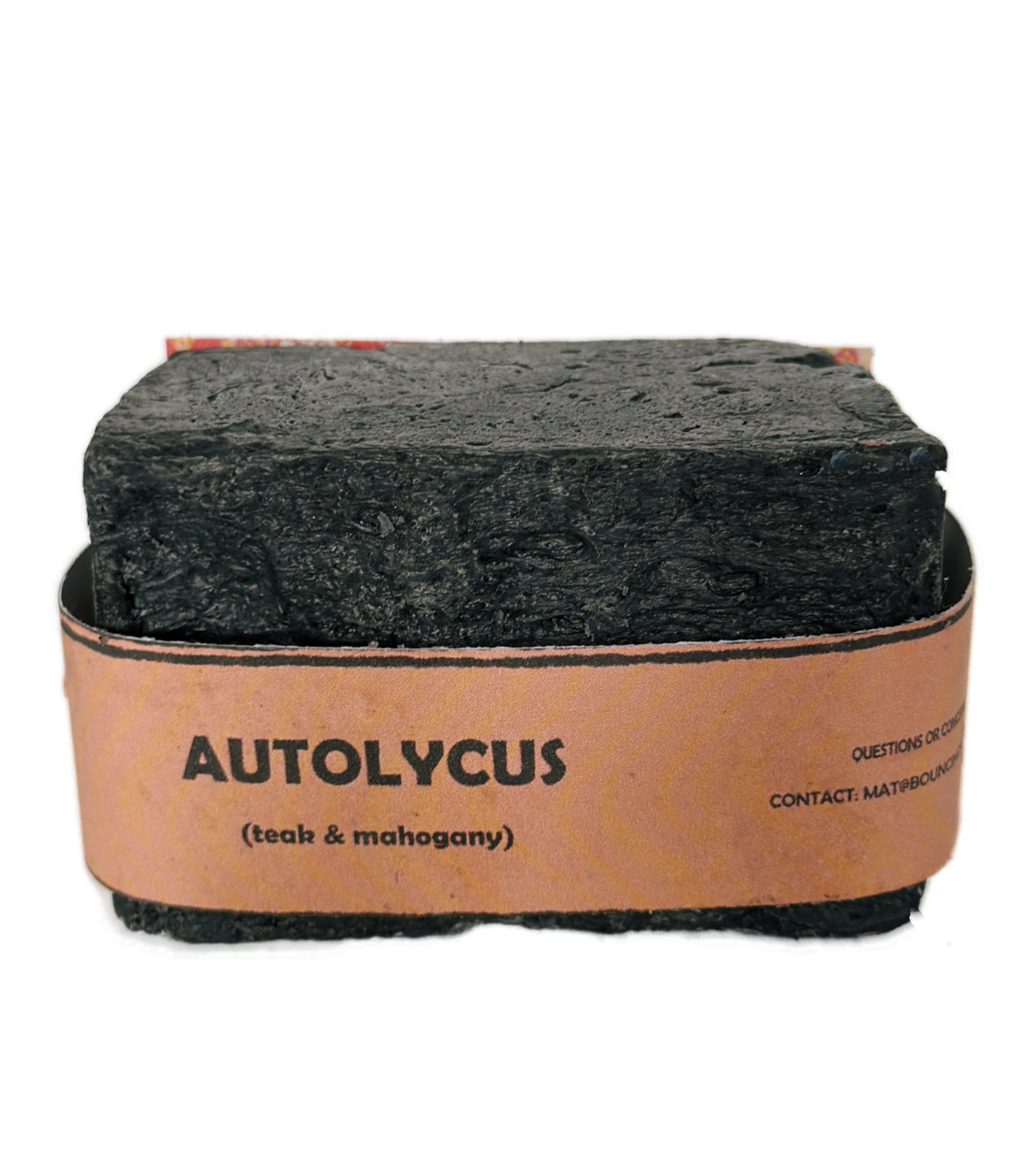 Single bar of Autolycus handmade soap by Bouncing Soaps showing dark black texture