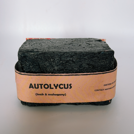 Single bar of Autolycus handmade soap by Bouncing Soaps showing dark black texture