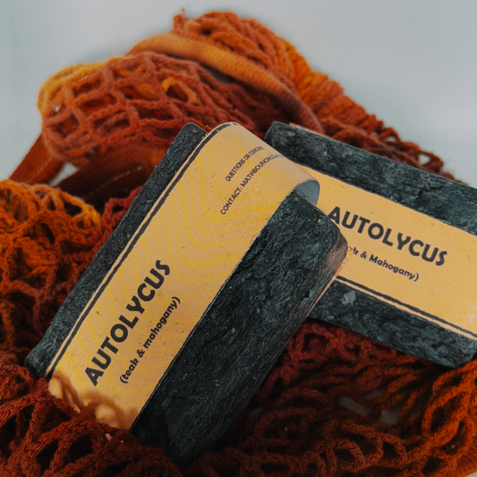 Assorted Bouncing Soaps handmade bar soaps in a red rope basket including black bar of Autolycus soap