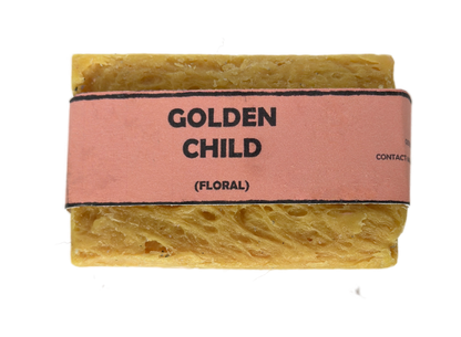 Golden Child floral handmade soap bar by Bouncing Soaps showing golden yellow rustic texture from above on white background