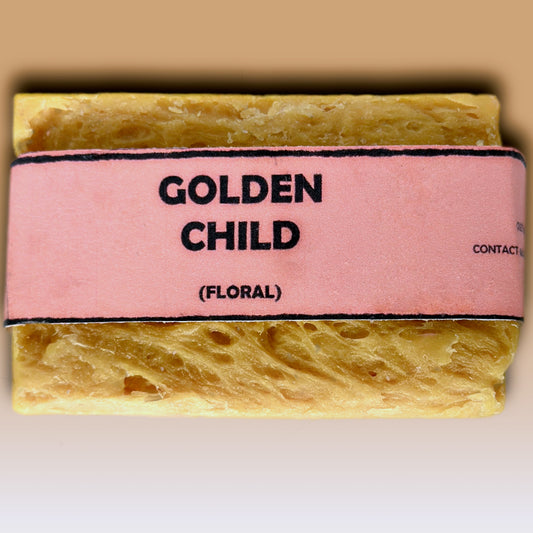 Golden Child floral handmade soap bar by Bouncing Soaps showing golden yellow rustic texture from above on white background